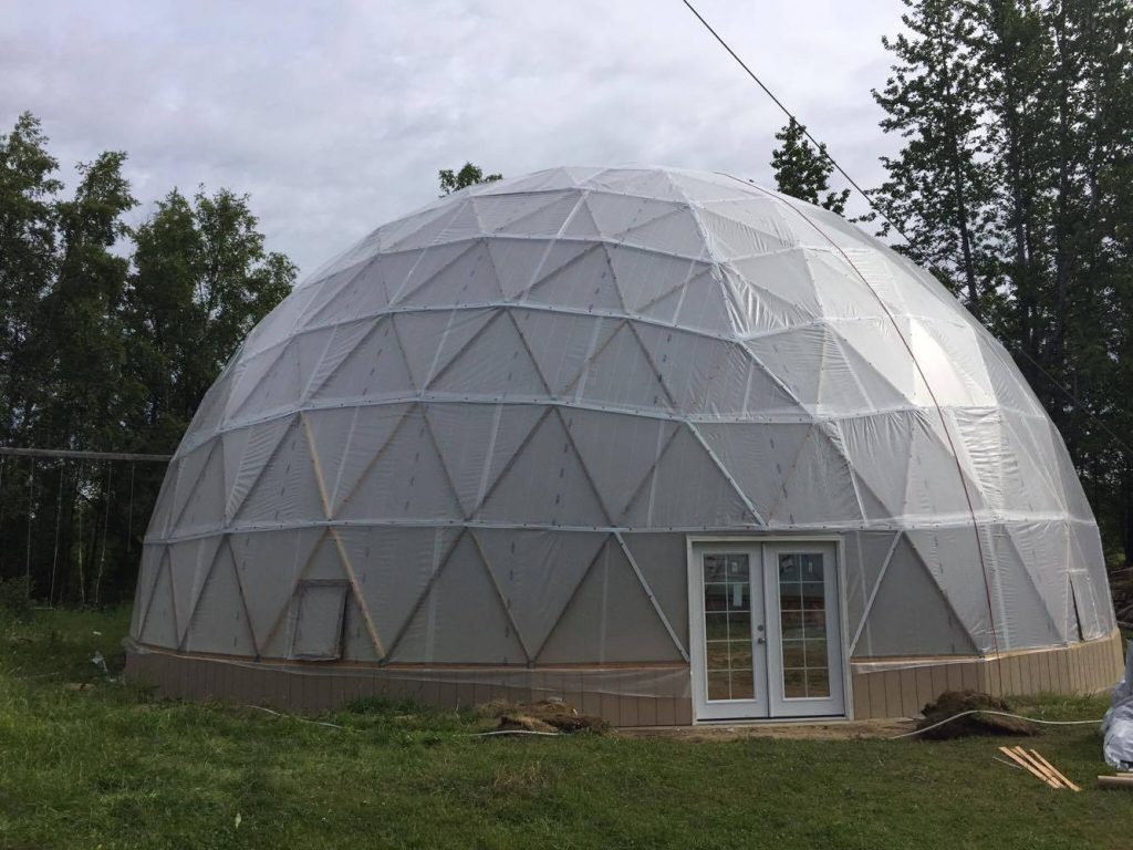 50 Foot Geodesic Dom Greenhouse with Double Doors. A greenhouse is a gardener's favorite winter hangout. #GeodesicDomeGreenhouse #DomeGreenhouse #GeodesicDomes #GardensAll.com 

