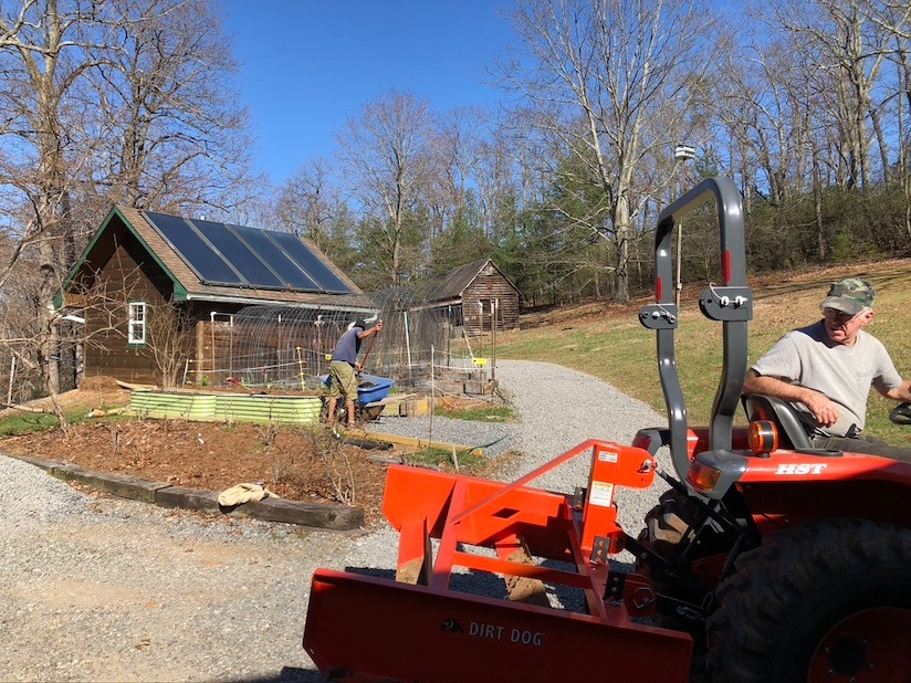 Adding metal garden beds and spreading gravel 